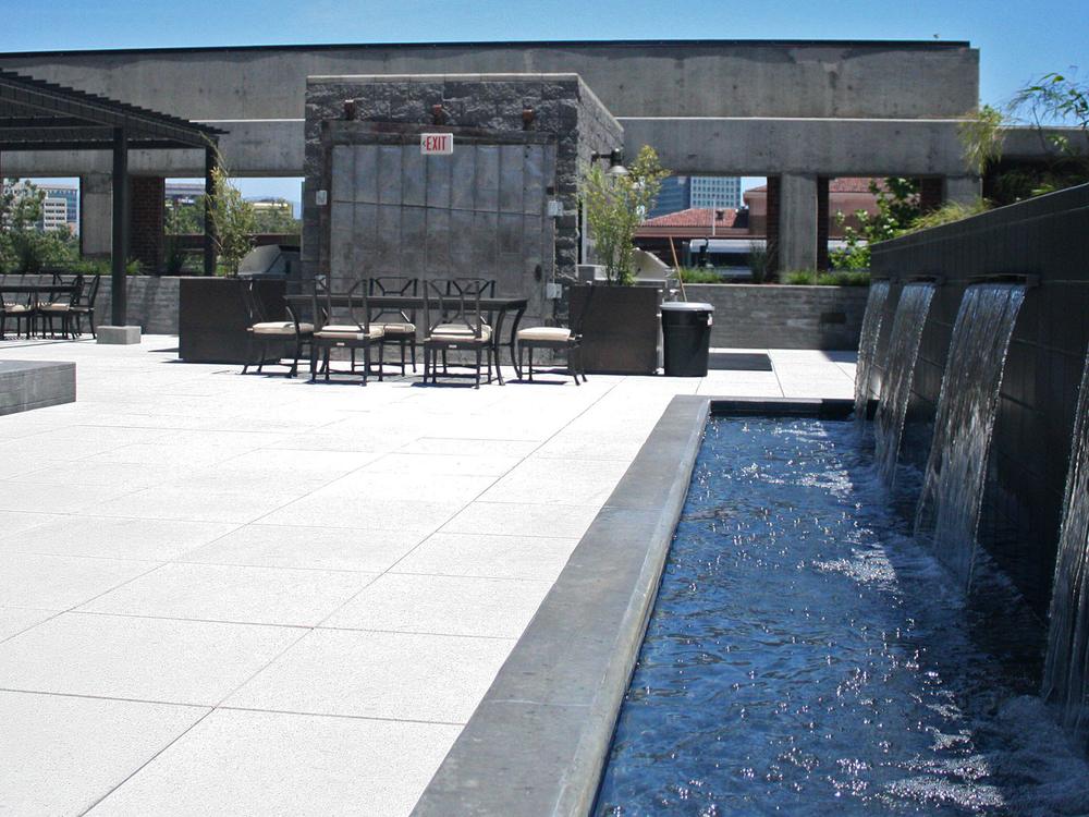 Courtyard fountain — sheets of water falling into the reflecting pool beside the outdoor dining terrace